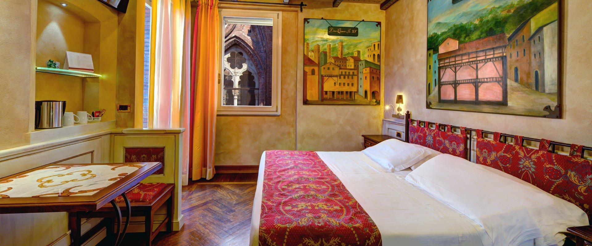 THE ALMA MATER AND THE ART HOTEL COMMERCIANTI: TWO STORIES THAT INTERTWINE Art Hôtel Commercianti Bologne THE ALMA MATER AND THE ART HOTEL COMMERCIANTI: TWO STORIES THAT INTERTWINE Art Hôtel Commercianti Bologne